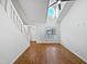 Bright living room with high ceilings, fresh paint, and hardwood floors at 8209 Rolling Glenn Dr, Raleigh, NC 27616