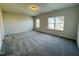 Spacious bedroom with plush carpet and bright natural light from two windows at 83 Commons Cir # 236, Clayton, NC 27520