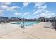 Exterior view of the community pool with chairs and a covered gazebo sitting area at 83 Commons Cir # 236, Clayton, NC 27520
