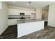 Stylish kitchen featuring a large island, stainless steel appliances, and granite countertops at 83 Commons Cir # 236, Clayton, NC 27520