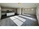 Spacious living room with abundant natural light and an open-concept design to the kitchen at 83 Commons Cir # 236, Clayton, NC 27520
