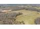 Wide aerial view of a rural landscape featuring fields, trees, and a construction site at 8835 Us 64, Siler City, NC 27344