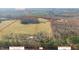 Expansive aerial view of the property and the surrounding landscape with projected lots outlined in red at 8835 Us 64, Siler City, NC 27344