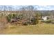 Exterior view of the house with a large yard and outbuilding at 8835 Us 64, Siler City, NC 27344