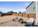 Fenced backyard featuring a fire pit, patio, play set and lush green grass at 917 Sequoia Ridge Dr, Fuquay Varina, NC 27526