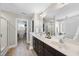 Bathroom featuring dual sink vanity, walk-in shower, and separate tub room at 917 Sequoia Ridge Dr, Fuquay Varina, NC 27526