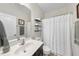 Bright bathroom with a single vanity, toilet and bathtub with shower at 917 Sequoia Ridge Dr, Fuquay Varina, NC 27526
