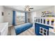 Bright bedroom features a blue area rug, loft bed and ample natural light at 917 Sequoia Ridge Dr, Fuquay Varina, NC 27526