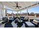 Outdoor patio with ample seating, area rug, ceiling fan and a view of the backyard at 917 Sequoia Ridge Dr, Fuquay Varina, NC 27526