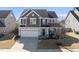 Charming two-story home with a welcoming front porch and a two-car garage at 917 Sequoia Ridge Dr, Fuquay Varina, NC 27526