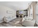 Bright living room with stone fireplace and built-in shelving flanking the sides at 917 Sequoia Ridge Dr, Fuquay Varina, NC 27526