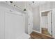 Mud room with a coat rack, hooks, and bench and view to the bathroom and closet at 917 Sequoia Ridge Dr, Fuquay Varina, NC 27526