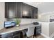 Office space with built in desk, overhead cabinets, monitor, and pendant lighting at 917 Sequoia Ridge Dr, Fuquay Varina, NC 27526