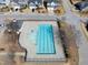 Aerial view of a community pool, a clubhouse and the surrounding landscape at 917 Sequoia Ridge Dr, Fuquay Varina, NC 27526