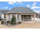 Rear exterior view featuring covered patio at 1003 Branwell Dr, Durham, NC 27703