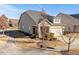 Charming home with a well-maintained lawn and inviting walkway leading to the entrance at 1003 Branwell Dr, Durham, NC 27703