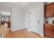 Bright foyer featuring hardwood floors, neutral walls, and convenient access to the kitchen and living areas at 1003 Branwell Dr, Durham, NC 27703