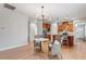 Bright eat-in kitchen featuring wood floors, stainless steel appliances, and pendant lighting at 1003 Branwell Dr, Durham, NC 27703