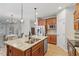 Open kitchen with stainless steel appliances, a granite island, hardwood floors and eat in kitchen area at 1003 Branwell Dr, Durham, NC 27703