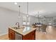 Eat-in kitchen with a large island, pendant lighting, wood floors and an open floor plan at 1003 Branwell Dr, Durham, NC 27703