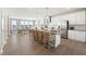 Bright and airy kitchen with a large island, stainless steel appliances, and a view into the dining area at 1237 S Blount Street # 201, Raleigh, NC 27601