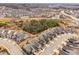 Aerial view of a suburban neighborhood, with lush greenery and a mix of residential homes at 124 Currituck Ln, Durham, NC 27703