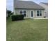 Spacious backyard featuring a well maintained lawn and patio at 124 Currituck Ln, Durham, NC 27703