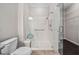 Bathroom featuring glass shower with safety bar, ceramic tile floor and tiled shower stall at 124 Currituck Ln, Durham, NC 27703