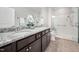 Bathroom featuring double vanity with granite countertop and glass enclosed shower with safety bars at 124 Currituck Ln, Durham, NC 27703