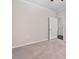 Bedroom with neutral carpet, ceiling fan, and doorway leading to other rooms in the house at 124 Currituck Ln, Durham, NC 27703