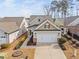Charming home featuring a two-car garage and a welcoming covered entry at 124 Currituck Ln, Durham, NC 27703