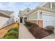 Inviting front entrance with a brick accent wall and manicured landscaping at 124 Currituck Ln, Durham, NC 27703