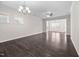 Bright living room with hardwood floors, chandelier, and ceiling fan at 124 Currituck Ln, Durham, NC 27703