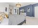 Stylish bedroom featuring a modern chandelier, large windows, and sophisticated gray and black accents at 1247 Shaw View Alley # 101, Raleigh, NC 27601