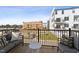 Relaxing balcony with outdoor seating and views of the surrounding construction at 1259 Shaw View Alley # 101, Raleigh, NC 27601