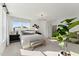 Sunlit bedroom with stylish decor, plush bedding, and a chic modern chandelier at 1259 Shaw View Alley # 101, Raleigh, NC 27601