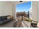 Cozy balcony with outdoor seating, offering a relaxed view of the community and surrounding construction at 1259 Shaw View Alley # 201, Raleigh, NC 27601