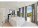 Bright bedroom with large windows and elegant black and white patterned curtains at 1259 Shaw View Alley # 201, Raleigh, NC 27601