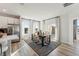 Bright dining room featuring a modern table set, elegant decor, large windows, and stylish curtains for a comfortable atmosphere at 1259 Shaw View Alley # 201, Raleigh, NC 27601