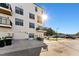 Modern townhome with a clean white facade and black accents, complemented by a well-maintained lawn and ample parking at 1259 Shaw View Alley # 201, Raleigh, NC 27601