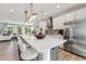 Bright, open kitchen with a large island, modern appliances, and an adjacent living area, perfect for entertaining and Gathering gatherings at 1259 Shaw View Alley # 201, Raleigh, NC 27601