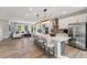 Bright, open kitchen with a large island, modern appliances, and an adjacent living area, perfect for entertaining and Gathering gatherings at 1259 Shaw View Alley # 201, Raleigh, NC 27601