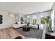 Bright living room boasts natural light, modern furnishings, and sleek flooring, creating an inviting space at 1259 Shaw View Alley # 201, Raleigh, NC 27601