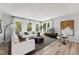Spacious living room with large windows, elegant decor, and plush seating for relaxing and entertaining at 1259 Shaw View Alley # 201, Raleigh, NC 27601