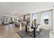 Open-concept living space with a spacious dining area, modern kitchen, and comfortable seating, bathed in natural light at 1259 Shaw View Alley # 201, Raleigh, NC 27601
