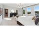 Bright main bedroom features large windows, sleek furnishings, and a relaxing atmosphere at 1259 Shaw View Alley # 201, Raleigh, NC 27601