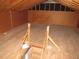Spacious attic with wooden floors and ladder access offers potential for storage or additional living space at 136 Dogwood Trl, Wendell, NC 27591