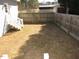 The backyard is fenced with stairs leading up to the house and a shed in the background at 136 Dogwood Trl, Wendell, NC 27591