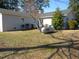 View of backyard with large propane tank at 136 Dogwood Trl, Wendell, NC 27591