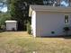 Side and backyard with a small shed at 136 Dogwood Trl, Wendell, NC 27591